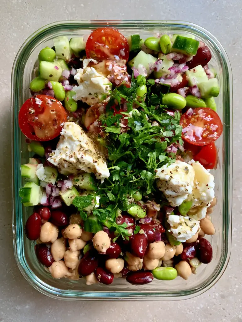 Dense Bean Salad Recipes: The Ultimate High-Protein Meal Prep Solution 1 Close up of diced Persian cucumbers and cherry tomatoes in dense bean salad recipes.